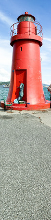 detail of red light house in the harbour of la speziaの写真素材
