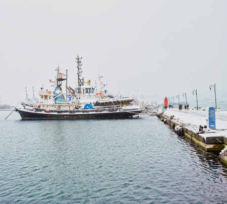 tug boat covered by snow in italyのeditorial素材