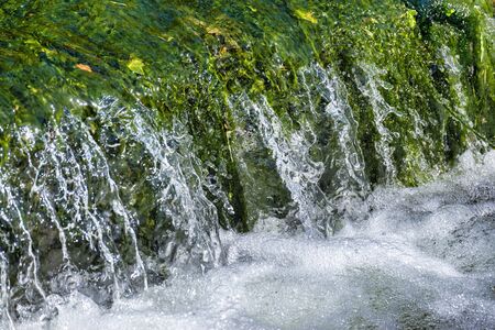detail of a fall in a little steamの写真素材