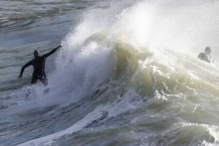 a surfer surf a wave in italy
