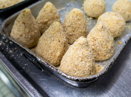 typical Sicilian food called arancini ready for cooking