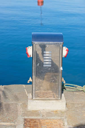 detail of column with built-in lighting for distribute electricity and waterの写真素材