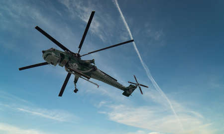 La Spezia, Italy - May 05, 2021: Erickson Air Crane helicopter (Sikorsky S-64) N243AC fly against different type of skyのeditorial素材