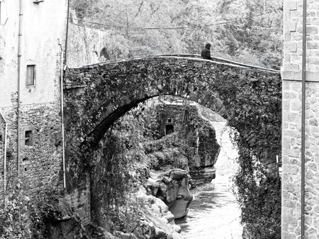 Bridge over a river at the old town of Bagnone at the Tuscany Region in Italyの写真素材