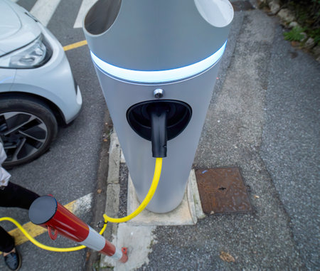 Power supply connect to electric vehicle for charge to the battery. Charging technology industry transport which are the futuristic of the Automobile. EV fuel Plug in hybrid car.の写真素材