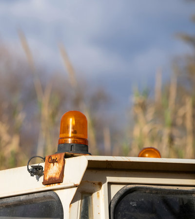 Orange signal lamp on forklift, excavator or other industrial and agricultural machine. Safety...
