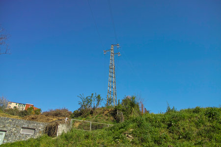 big electric tower in a meadow in La Speziaの写真素材