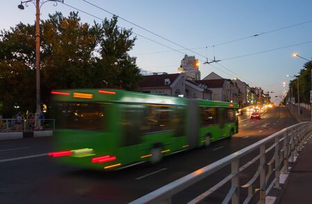 The motion of a blurred bus in the street in the evening.   の写真素材