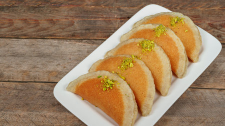 Qatayef, Traditional Arabic Ramadan Sweets on plate,top viewの写真素材