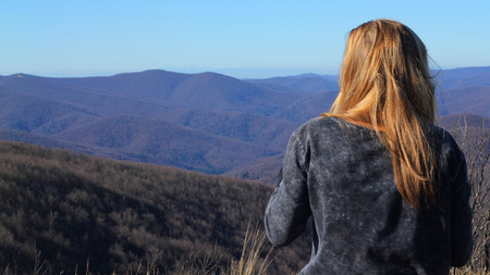 Beautiful young woman in mountainの写真素材