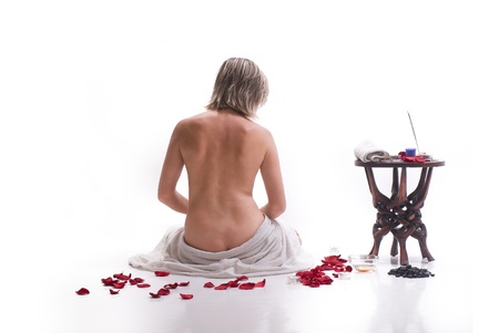 Woman in white towel relaxing in spaの写真素材