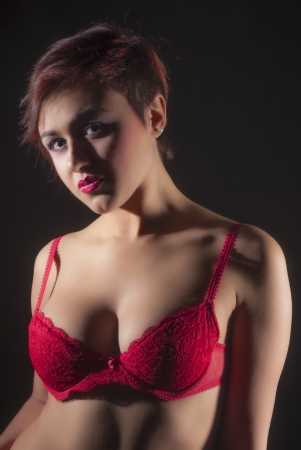 Sexy woman in red lingerie isolated on black backgroundの写真素材