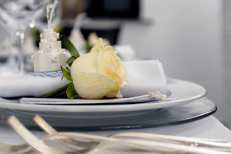 Details of a wedding table with a yellow roseの写真素材