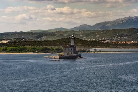 Coastline of Old Saline in Olbia with a building in the sea, Sardinia, Italyの写真素材