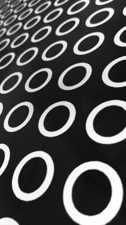 Photo of graphics, white circles on black background