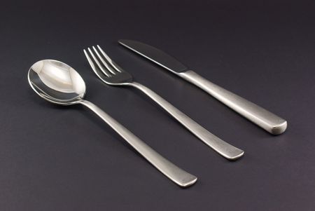 Cutlery Inox, Fork, knife, spoon on black backgroundの写真素材