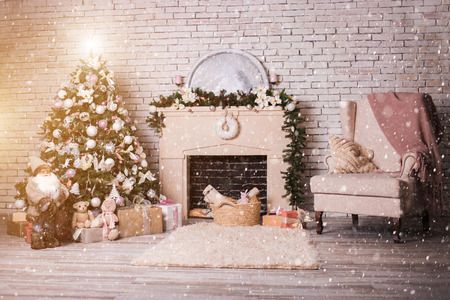 Beautiful holdiay decorated room with Christmas tree with gift under it. Bright and cosy roomの写真素材