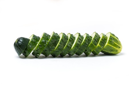 Sliced fresh green cucumber, slices on white background, isolate