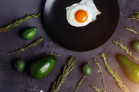 Healthy Breakfast, proper nutrition, diet, food concept. Egg, fried eggs in a plate and green...