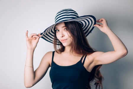 Beautiful fashionable woman wearing hat. summer holidaysの写真素材