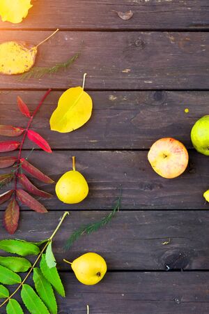 Apples and pears on a wooden backgroundの写真素材