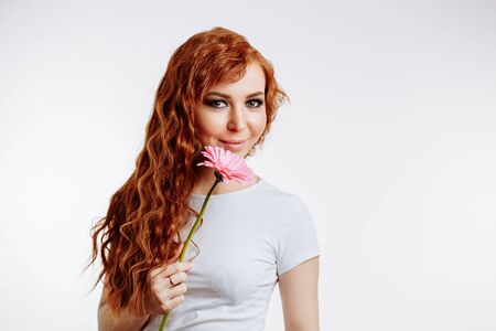 Closeup portrait of smiling, beautiful cute woman in casual clothes with smile. long ginger curly...