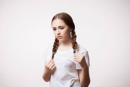 Portrait of a sad woman look down on white background. Negative emotions, feelings