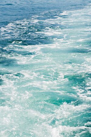 Beautiful waves on the black sea, close up. The trail from the boatの写真素材