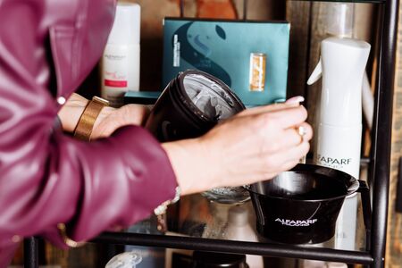 Cosmetologist applying mask on client's or a beautician hand in spa salon, closeup. Cream, makeup, cosmetics, Spa, careの写真素材