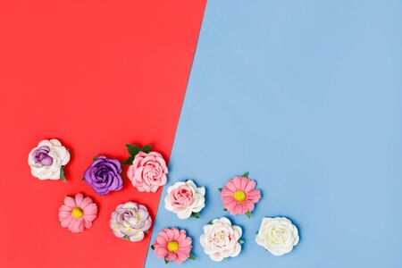 Bright colorful background with roses. Place for text. Flat lay, top view.の写真素材