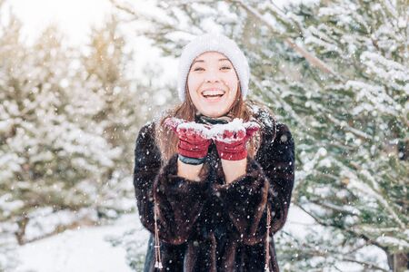 Winter woman Blowing Snowの写真素材