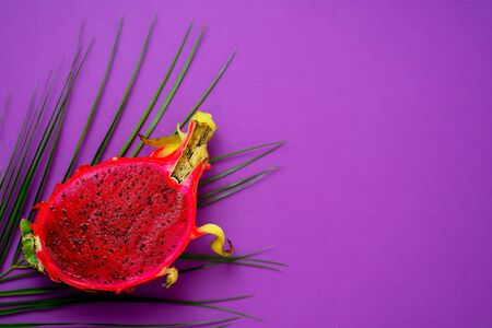 Dragon fruit isolated on violet background