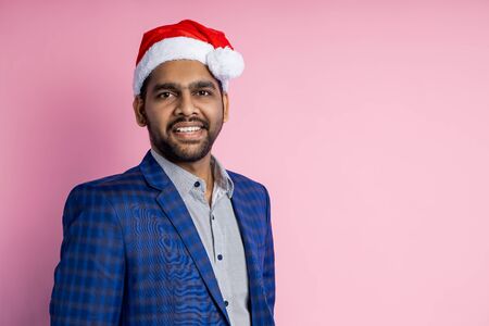 Indian young businessman wearing Santa hatの写真素材