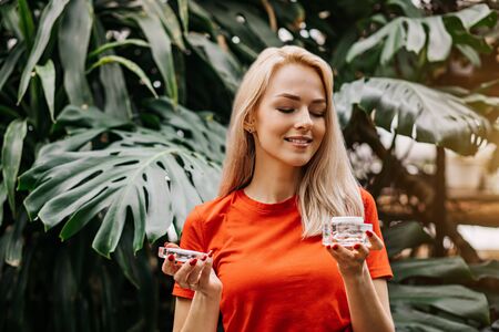 Beautiful woman holding beauty productの写真素材