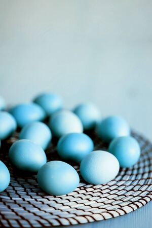 Raw fresh blue chicken eggs on rustic wooden table. Selective focus. Organic food, healthy eating, dieting, protein, farm products concept. Copy space.の写真素材