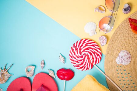Beach accessories on yellow blue backgroundの写真素材