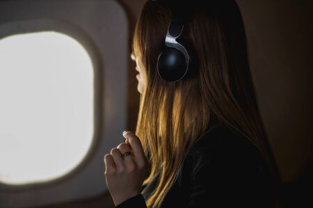 Attractive woman in private jetの写真素材
