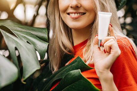 Beautiful woman holding beauty productの写真素材