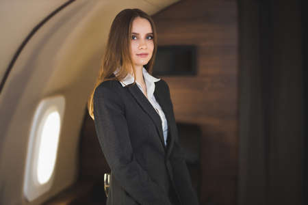 Attractive woman in private jetの写真素材