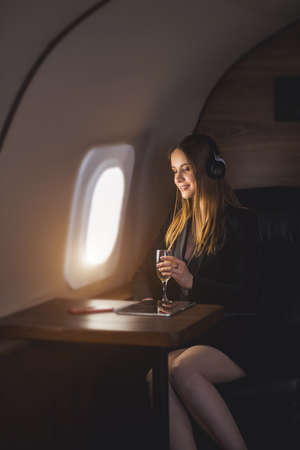 Attractive woman in private jetの写真素材