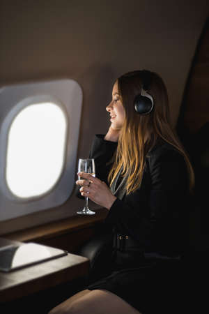 Attractive woman in private jetの写真素材