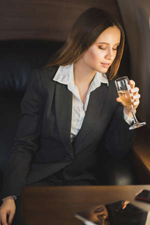 Attractive woman in private jetの写真素材