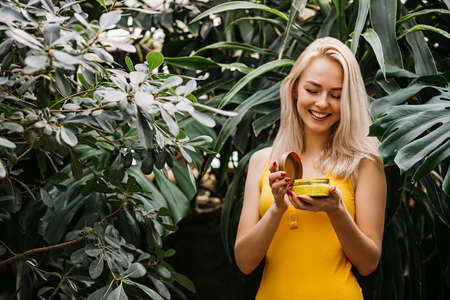 Beautiful woman holding beauty productの写真素材