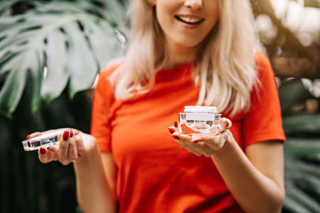 Beautiful woman holding beauty productの写真素材