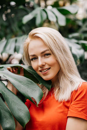Blonde woman in tropical forestの写真素材