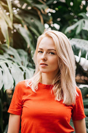 Blonde woman in tropical forestの写真素材