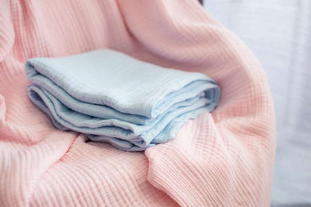Pressed muslin, blue and pink baby blankets. Fabric, textiles, clothing concepts closeupの写真素材