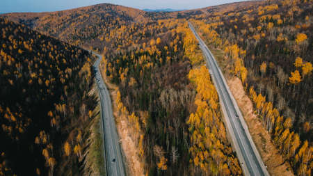 The view from the top, the drone photo. Beautiful autumn, cars