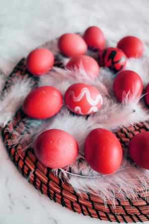 Abstract red eggs on white fluff close-up. Easter spring conceptの写真素材