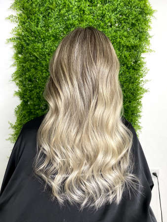 hair. dyed hair. hair coloring. beautiful hair. dyed hair in a beauty salon.の写真素材